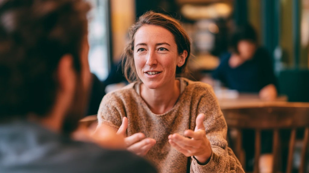 Someone speaking confidently in a new language, mid-conversation